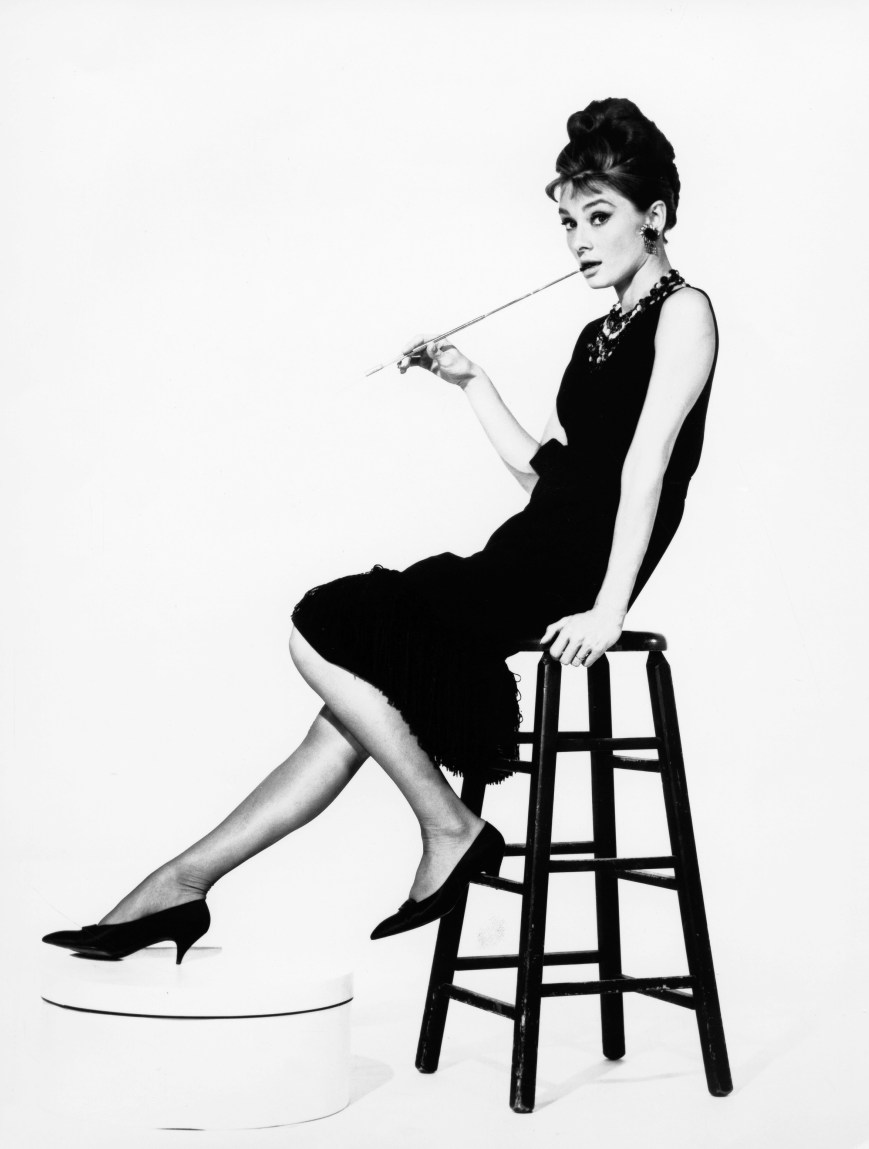 Audrey Hepburn, actress. Portrait on a bar stool. film still Breakfast at Tiffan